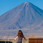 Woman looking over a mountain in South America