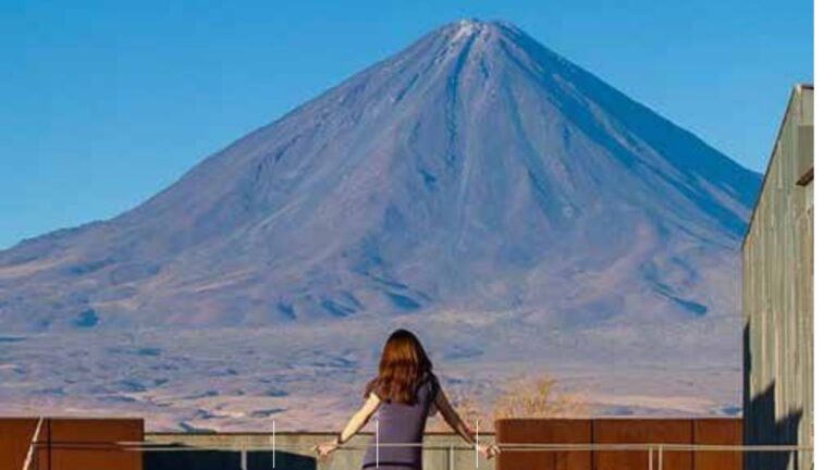 Woman looking over a mountain in South America