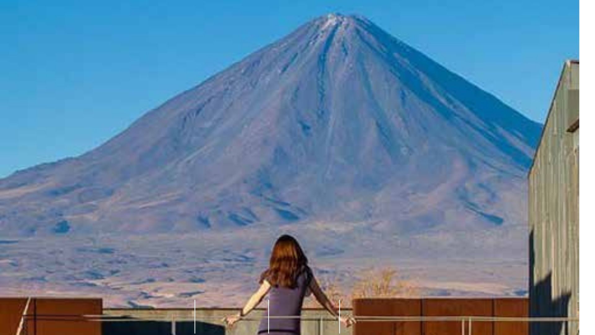 Woman looking over a mountain in South America